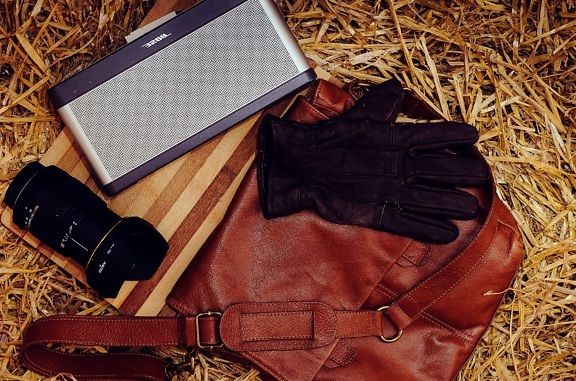 camera, leather gloves, lens, leather bag