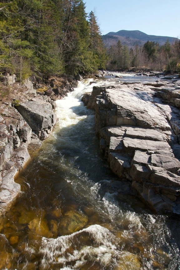 creek water, fast river, big rocks, river, rocks, trees, mountains