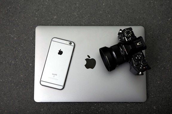 macbook computer, digital camera, iPhone