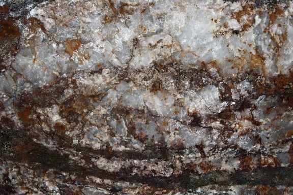 white quartz rock, texture, hematite, iron, rust, stains