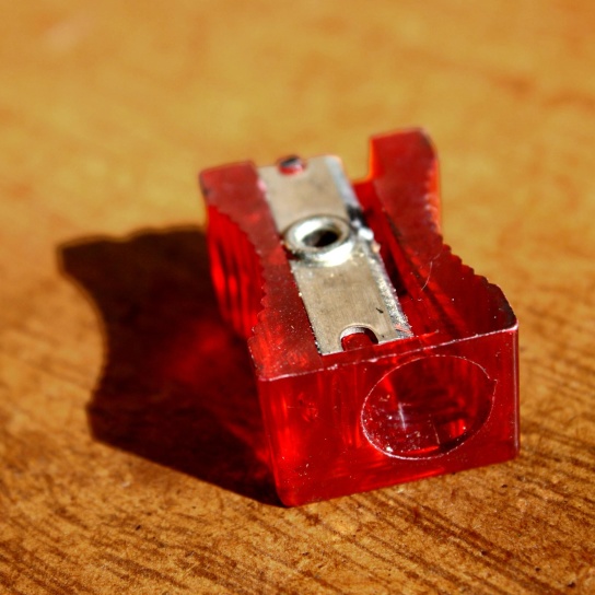 red, plastic, pencil sharpener