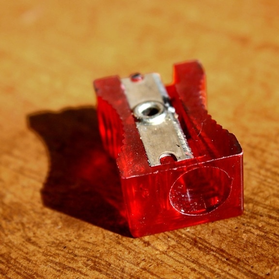 red, plastic, pencil sharpener