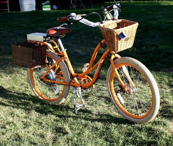 female bicycle, orange bicycle, backyard