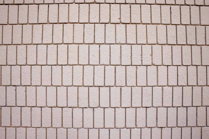 colore beige, muro di mattoni, la consistenza, i mattoni verticali