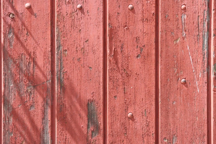 old wood fence, peeling red paint, wooden planks, texture