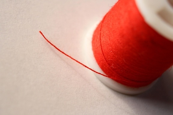 spool, sewing thread, red thread