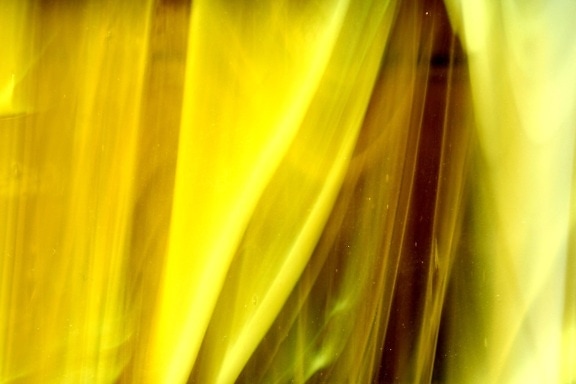 curled glass, yellow glass, close, texture