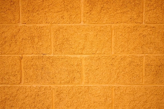 ladrillos pintados de amarillo, bloques de hormigón, pared, textura
