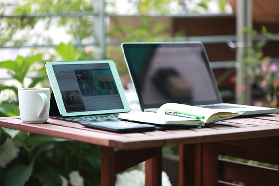 laptop computer, mug, table, gadget, coffee cup, desk, office