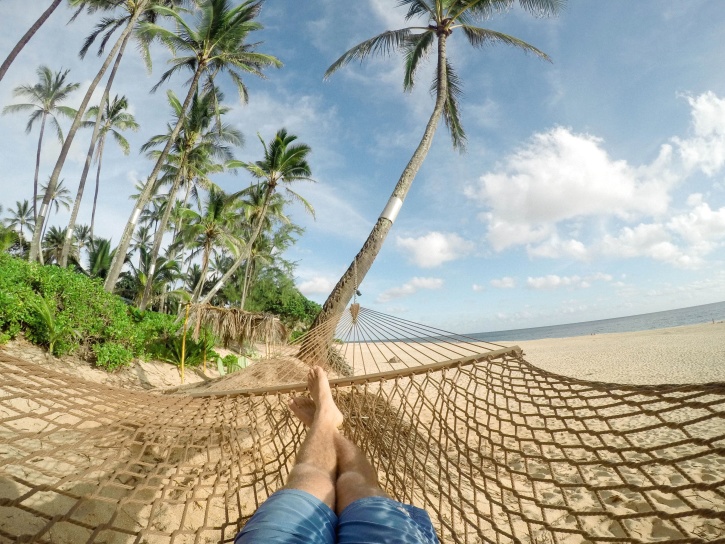 person sunbathing, tropical beach, summer season
