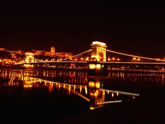 calm water, bridge, night, buildings, city