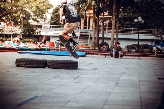 extreme sport, street, tire, tree, recreation, road, people, performance, trick