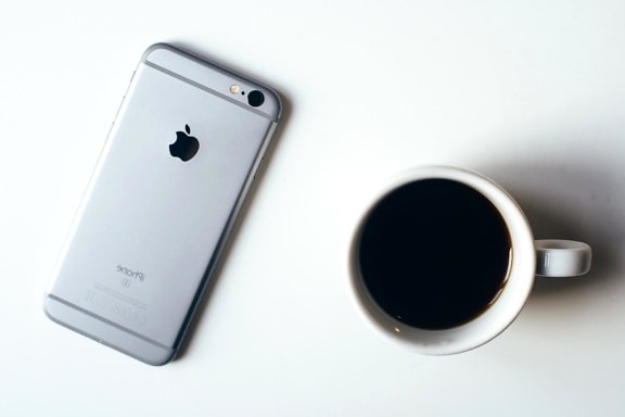 coffee cup, phone, table