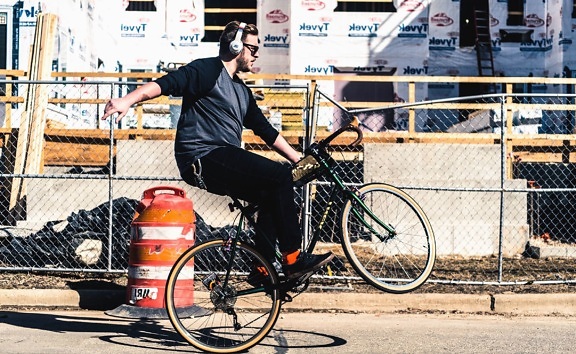 bicycle, vehicle, man, person, people, headset, fence