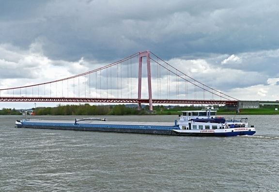 river, bridge, boat, water, vehicle, transport, sky, coast