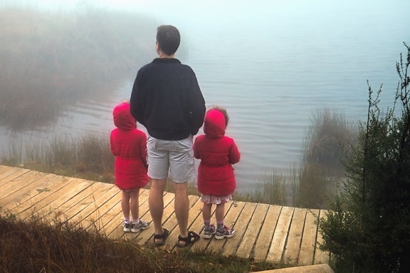 man, child, shore, lake, reflection, fog, tree, plank, path