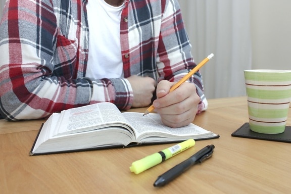 desk, man hold a pencil, student, book, pencil, education