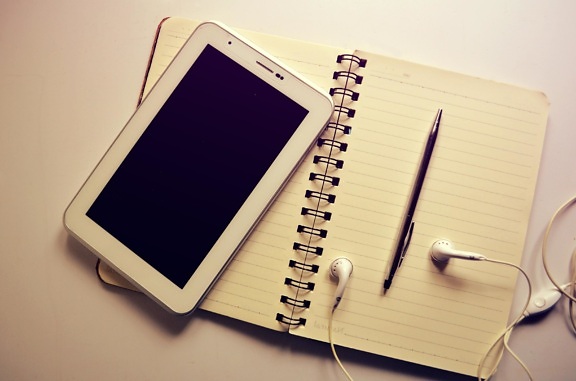 mobile phone, telephone, paper, notebook, headphones