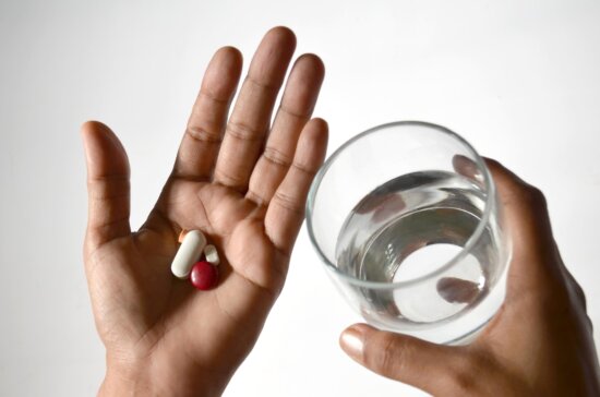 hand, finger, glass, water, medicine, dietary supplement, vitamin