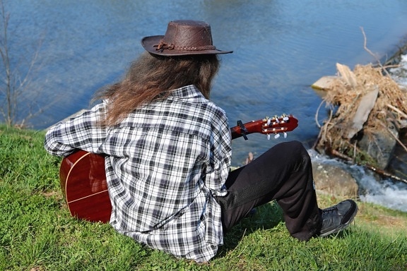 people, hat, man, outdoor, person, grass, guitar, music