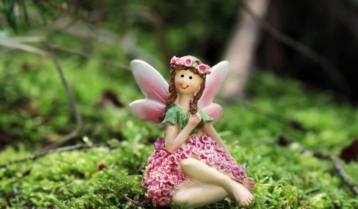 toy, doll, girl, wing, moss, nature, flower, object, figure
