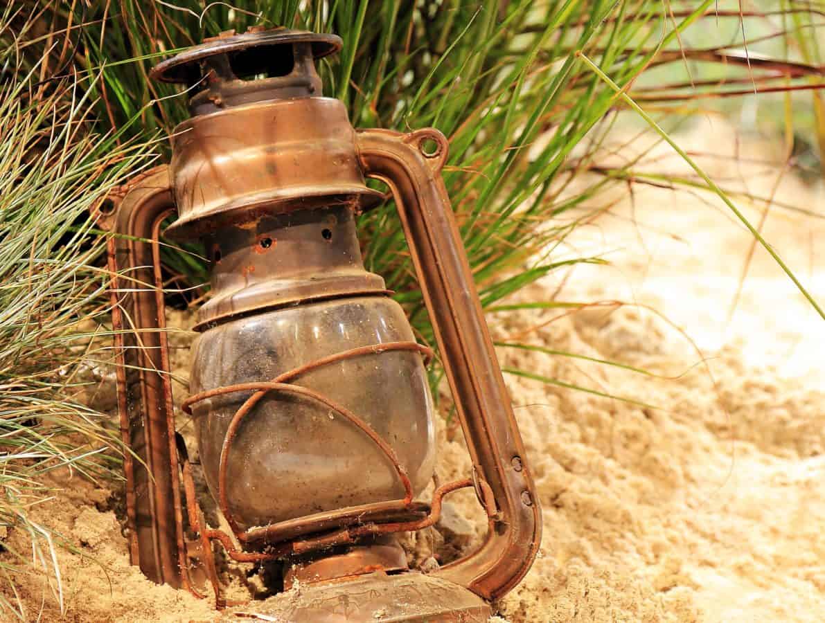 sand, ground, object, rust, metal, lamp, grass, old