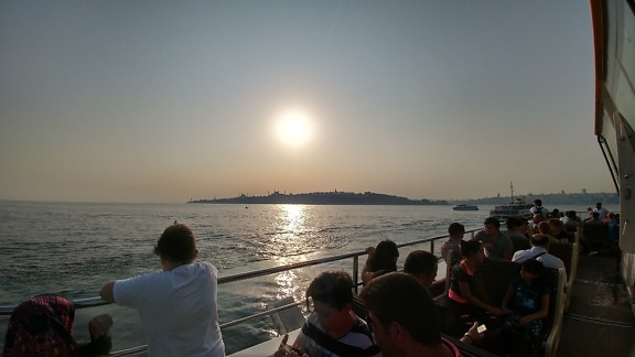ocean, sunset, crowd, travel, tourism, people, sea, water, watercraft, beach, coast, shore