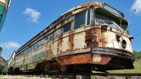 vehicle, blue sky, outdoor, transport, rust, locomotive, railway, train