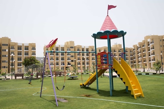 playground, daylight, area, park, building, location, grass, sky