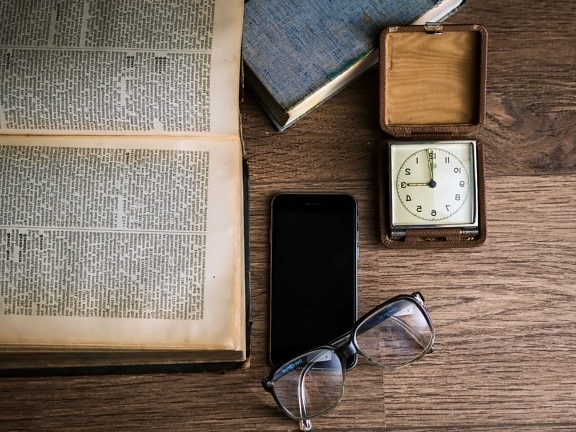 book, cellphone, clock, eyeglasses, mobile phone, wood, container, retro