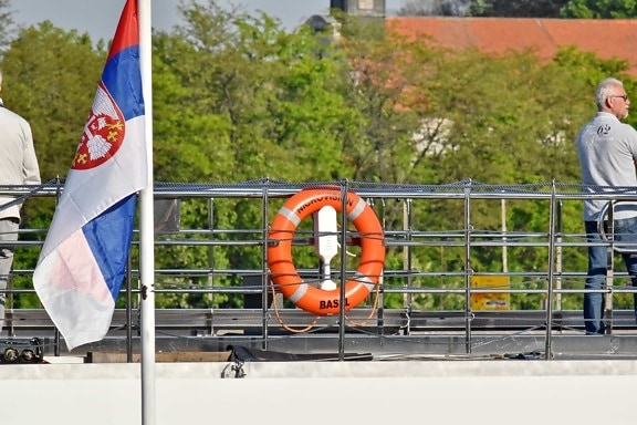 cruise ship, flag, Serbia, life preserver, people, outdoors, chair, building, business, man