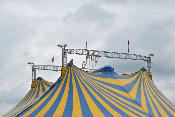 tent, circus, festival, outdoors, rope, landscape, flag, color, blue sky, city
