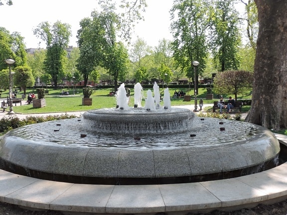 cityscape, urban area, fountain, structure, park, garden, architecture, outdoors, water, tree