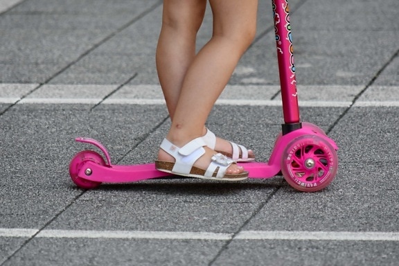 legs, pavement, pinkish, toy, leisure, vehicle, conveyance, tricycle, street, road