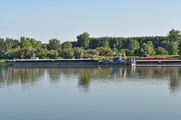 barge, boats, channel, riverbank, vehicles, water, river, watercraft, vehicle, reflection