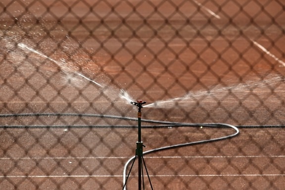 hose, irrigation, spraying, tennis court, fence, barrier, safety, protection, competition, outdoors