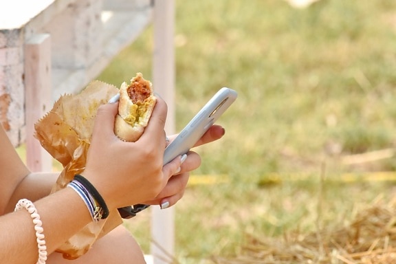 hay, mobile phone, sandwich, summer, technology, outdoors, woman, nature, food, girl