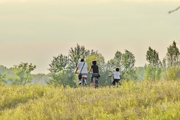 bicycle, countryside, enjoyment, family, father, lifestyle, mother, physical activity, relaxation, son