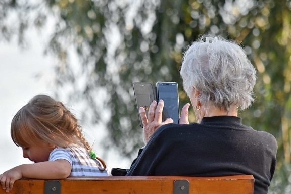 entertainment, grandchild, granddaughter, grandmother, mobile phone, relaxation, togetherness, outdoors, leisure, child