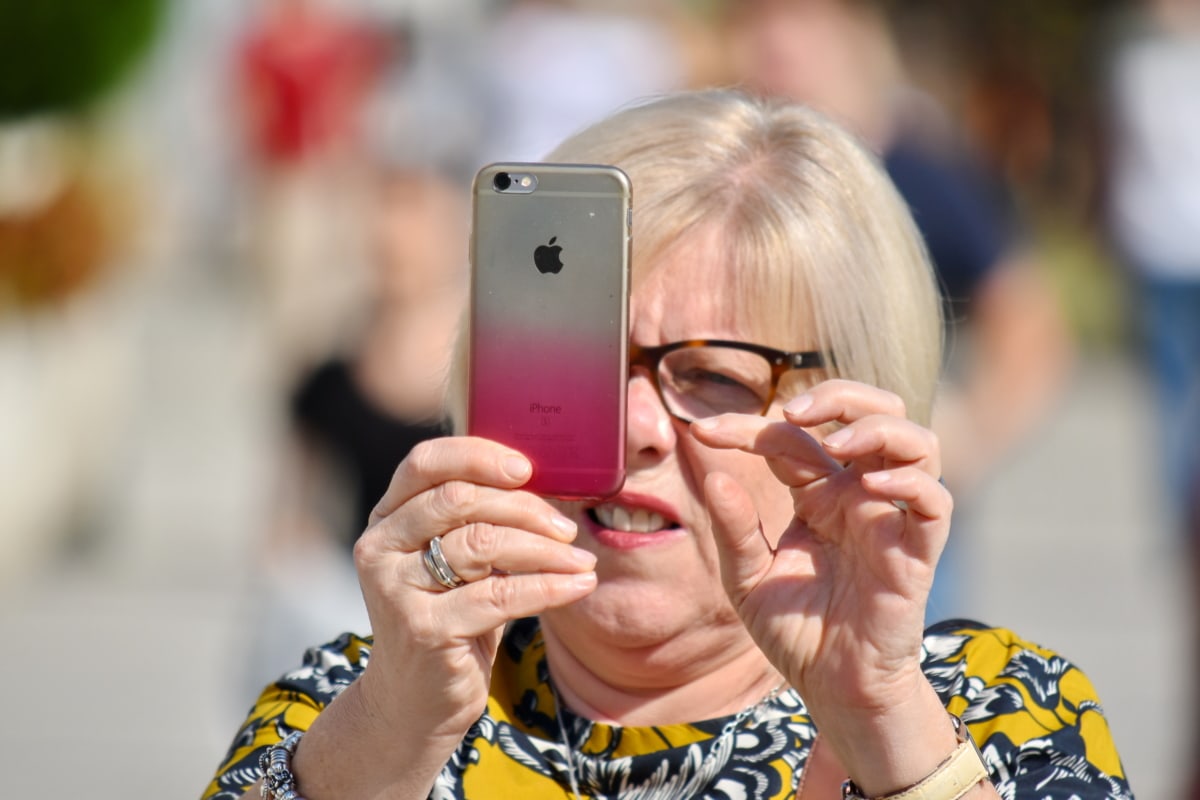 apple computer, blonde hair, face, finger, mobile phone, portrait, woman, telephone, outdoors, people