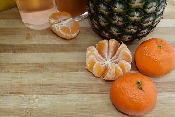 fruit juice, kitchen table, mandarin, pineapple, produce, tangerine, orange, food, citrus, fruit