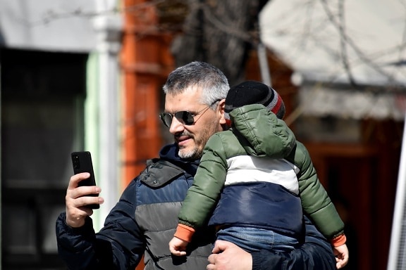 family, father, holding, love, mobile phone, son, telecommunication, photographer, street, man