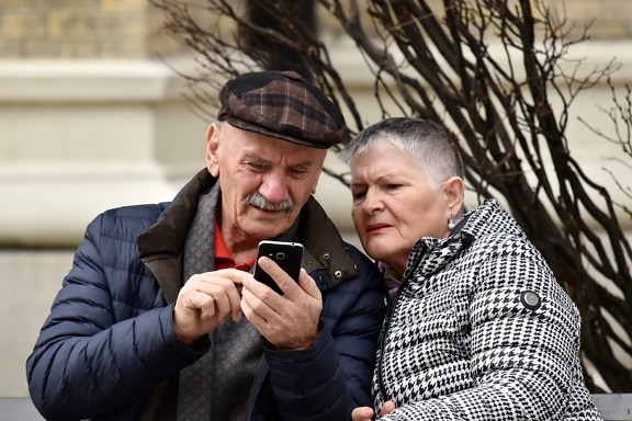 elderly, family, internet, man, mobile phone, telecommunication, togetherness, woman, couple, happy