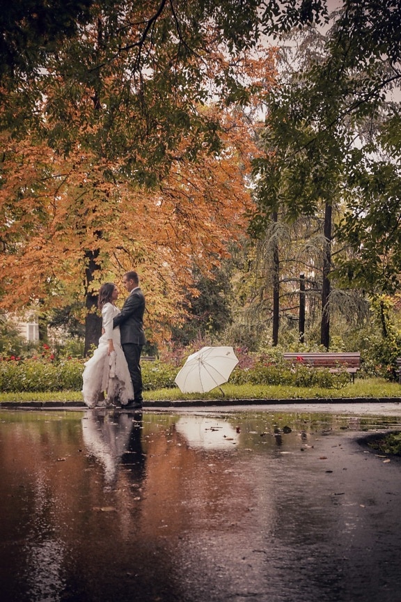 autumn season, dress, gorgeous, groom, park, rain, raindrop, suit, umbrella, wedding