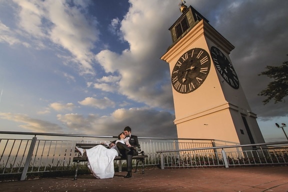 analog clock, groom, kiss, landmark, pretty, relaxation, sunset, tower, wife, architecture