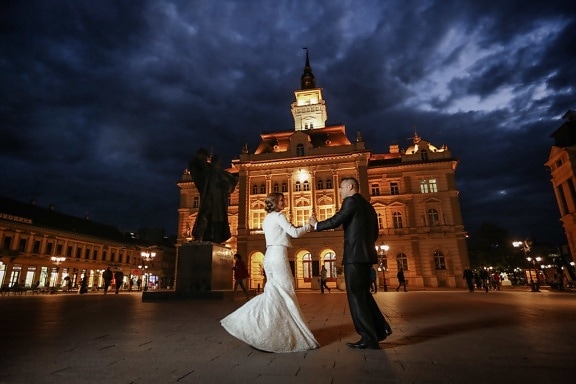 bride, cityscape, elegance, groom, hands, handsome, landmark, moonlight, walking, architecture