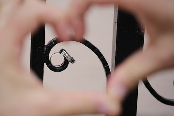 cast iron, fence, finger, focus, hands, heart, love, pair, rings, romance