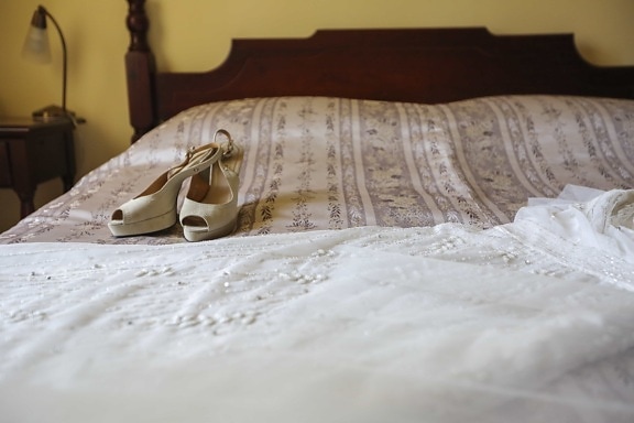 bed, bedroom, sandal, shoes, wedding dress, pillow, cushion, room, furniture, hotel