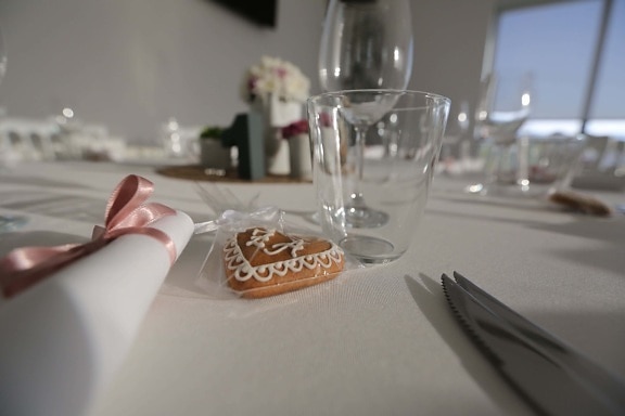 biscuit, dinner table, glass, glassware, heart, knife, napkin, table, restaurant, party