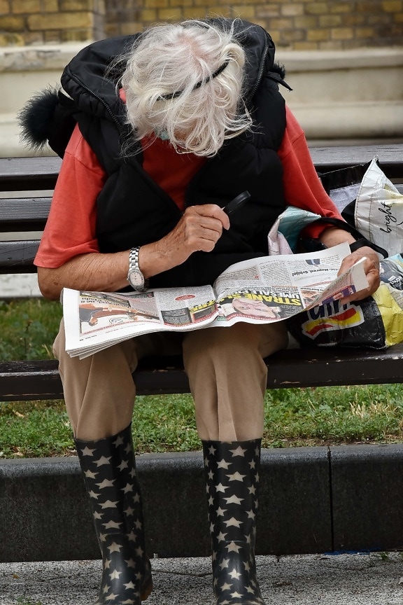 elderly, newspaper, reading, woman, eye disease, street, people, urban, outdoors, education
